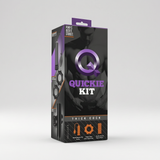 The retail packaging box for the Quickie Kit, a men's thick cock stimulator. The box is black with purple and orange accents, featuring a graphic of a muscular man and the product name 'QUICKIE KIT' in bold purple and white text.